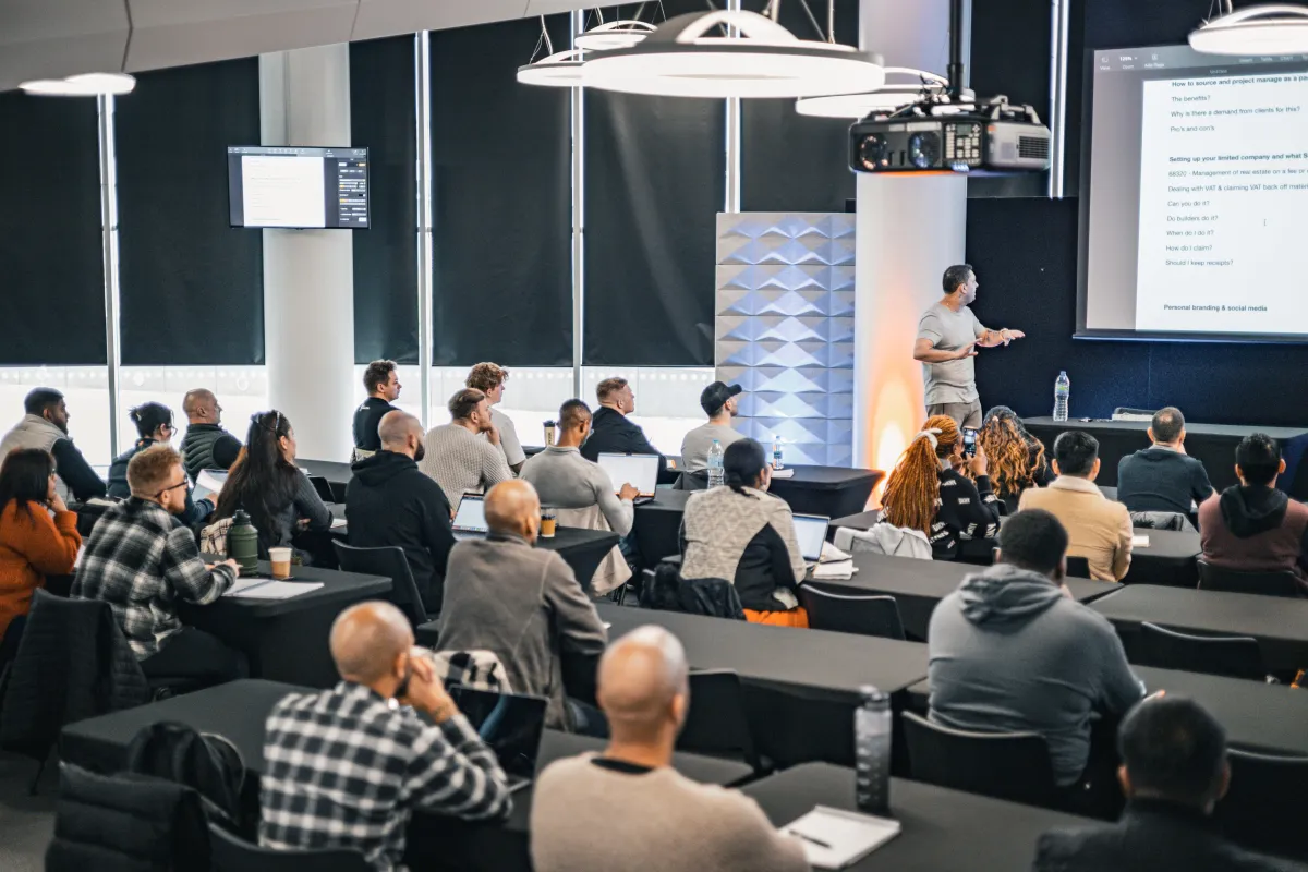 Members in a live property training workshop